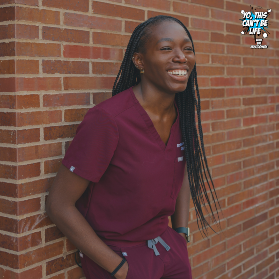 Dr. Mare Mbaye Black women with braids in  burgandy medical scrubs